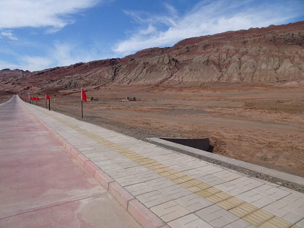 The rust-red sandstone ridges of the Flaming Mountains near Turpan