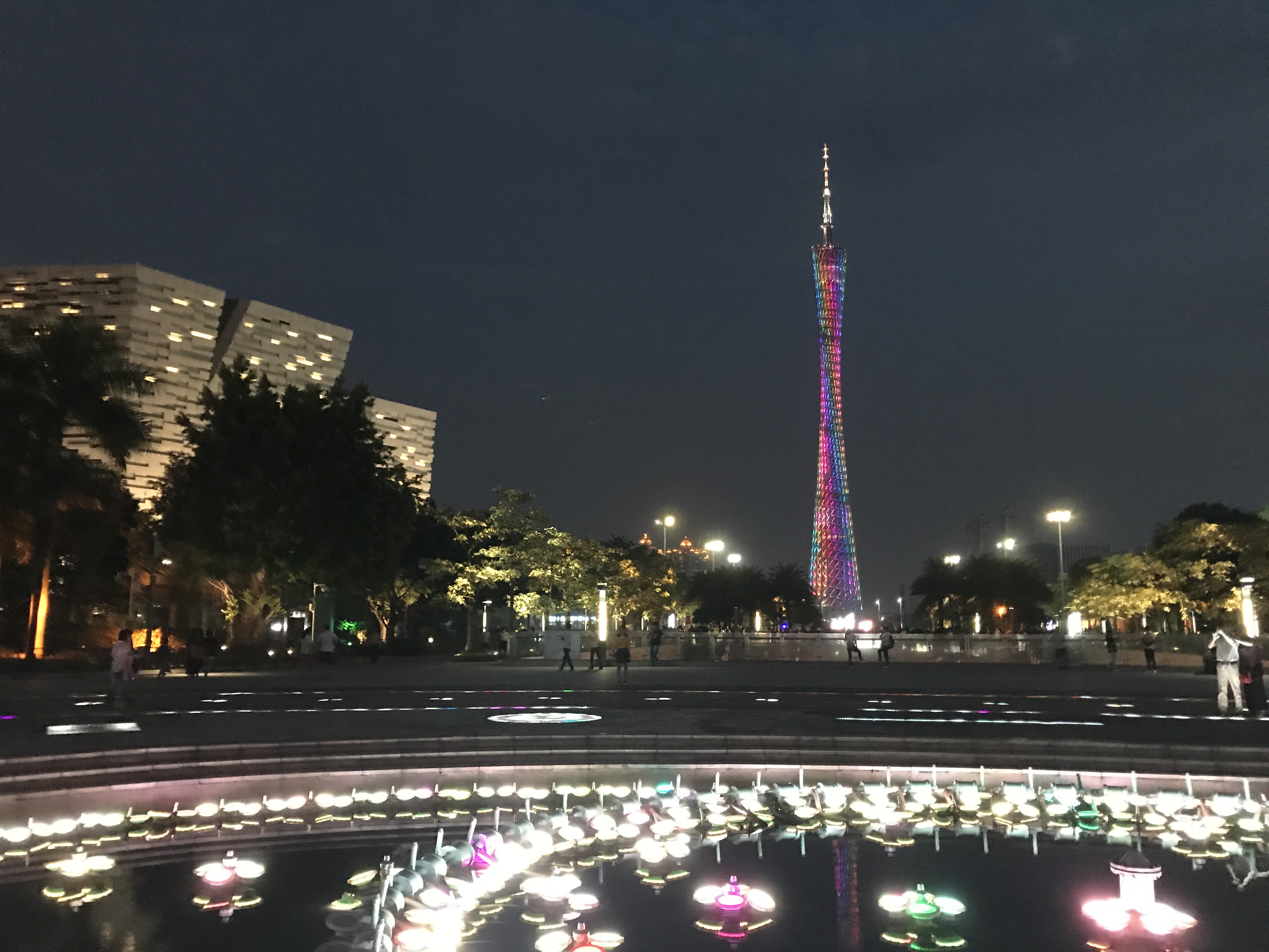 Guangzhou Canton Tower rising above Huacheng Square at night in Guangzhou
