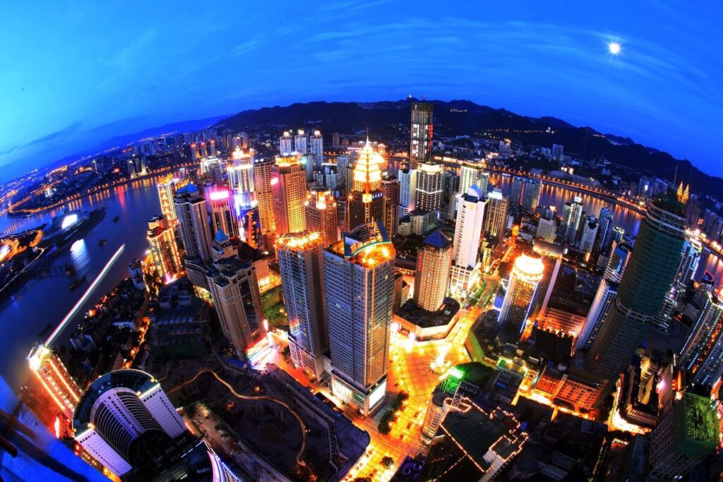 Chongqing Chongqing skyline illuminated at night over the rivers